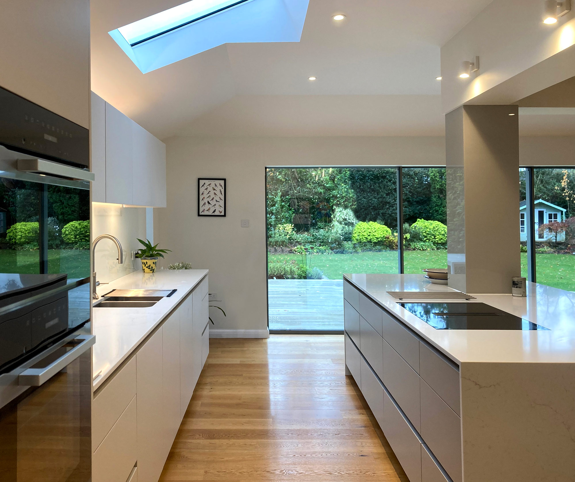 Orwell Heath - Complete interior renovation of residence in Cobham with Roundhouse designer kitchen and Millboard landscaping scheme to the exterior.